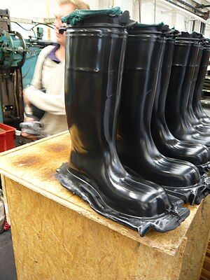 Compression molded (cured) rubber boots before the flashes are removed.