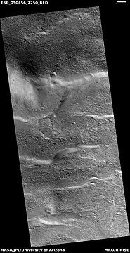 Wide view of surface with spots displaying mantle, as seen by HiRISE under HiWish program. Location is the Arcadia quadrangle.