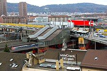 Railway station under the bridge, and tram/bus stop on the bridge