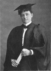 A woman in collegiate garb