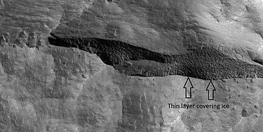 Close view of depression, as seen by HiRISE under HiWish program. Arrows indicate where there is a very thin, 1–2 meter covering on what is believed to be ice.