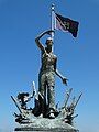 Liberation statue with POW flag