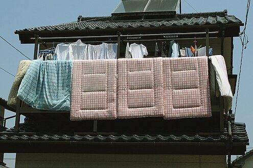 The pink tartan shikibutons are through-quilted; the green kakebutons may be quilted, but seem to still be in their covers.