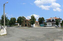 In front of the church and municipal hall