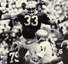 Michigan defender Carl Russ rushing quarterback in 1973