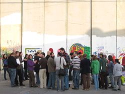 Guerrilla Tarbut in a poetry event against the sepration wall, Abu Dis, East Jerusalem, Israel 2009