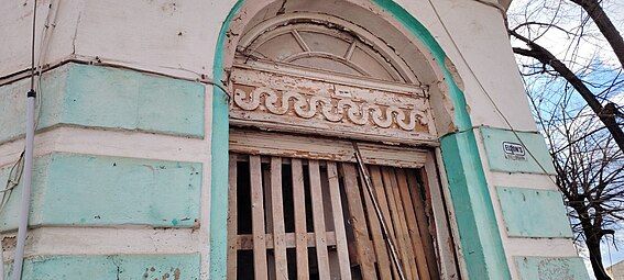 Vitruvian scroll on a building of a typical style for the late 19th to early 20th-century eclectic architecture on the Balkans, combining neoclassical influences such as the Vitruvian scroll patterns often seen in classical art and architecture. Built in Popovo, Bulgaria, c. 1925