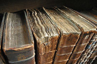 Old book bindings in the college library of Merton College. The college dates from the 1260s and is one of the contenders (along with University College and Balliol College) for the title of the first-established college. The oldest part of the library dates from 1373. The library holds approximately 70,000 volumes and 300 medieval manuscripts.