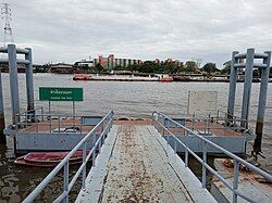 Thanon Tok Pier, a port for loading and unloading goods at the end of Charoen Krung Road, where it is referred to as Thanon Tok