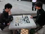 Playing chess at downtown Ithaca (left: myself)