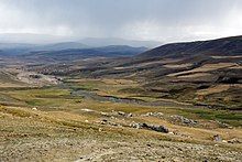 A river flowing through a wide valley