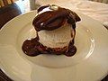 Single profiterole with ice cream and chocolate ganache