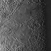 Two large cryolava lakes on Triton, seen west of Leviathan Patera. Combined, they are nearly the size of Kraken Mare on Titan. These features are unusually crater free, indicating they are young and were recently molten.