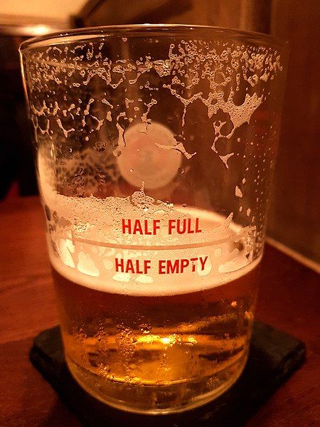 File:HalfFullHalfEmptyBeerGlass.jpg