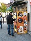 A French fry vending machine in use