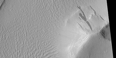 Dark slope streaks on mound in Lycus Sulci in Diacria quadrangle, as seen by HiRISE under HiWish program