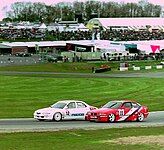 Matt Neal (Mazda Xedos) disputing a position with Geoff Steel (BMW 318is) at Brands Hatch during the 1994 BTCC Championship.