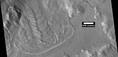 Glacier coming out of valley, as seen by HiRISE under HiWish program. Location is rim of Moreux Crater. Location is Ismenius Lacus quadrangle.