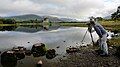 Myself posing as a photographer at Loch Awe with Kilchurn Castle in the background