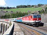 ÖBB 1044 274-7 with Express train from Croatia passing a viaduct on the Semmering line in Lower Austria