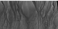 Close-up of channels in gullies showing that the paths of the channels changed over time. This feature suggest formation by running water with a high load of sediment. Picture was taken with HiRISE under HiWish program. Location is the Mare Acidalium quadrangle. Note this is an enlargement of a previous image in Phaethontis quadrangle.
