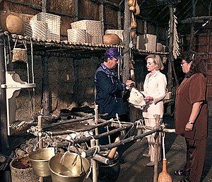 Three people admiring baskets