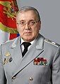 Ruslan Tsalikov in a grey dress uniform