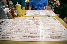 Picture of a white menu with red text from Katz's Delicatessen, New York City