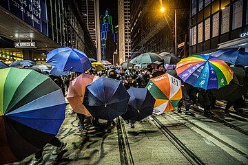 Protesters using umbrellas