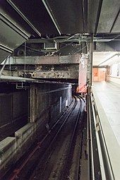 Tracks visibly curving around the terminal near a platform