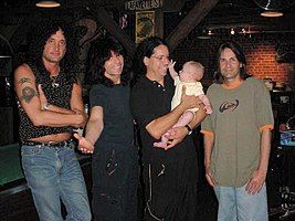 The Metal Health-era lineup of the band in 2002: (L to R) Kevin DuBrow, Rudy Sarzo, Frankie Banali, and Carlos Cavazo.