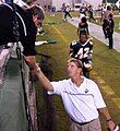 The Band Director shakes hand during a game