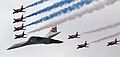 Image 66Concorde (and the Red Arrows with their trail of red, white and blue smoke) mark the Queen's Golden Jubilee. With its slender delta wings Concorde won the public vote for best British design. (from Culture of the United Kingdom)