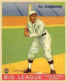 A baseball card picturing Al Simmons batting in a white uniform