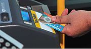 A Compass Card being tapped on an integrated farebox validator