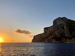 The sunset at the beach of Cala Goloritzè, second stop of the Selvaggio Blu