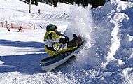 Tobogganing child in the Laterns-Gapfohl ski area