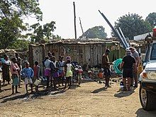 Street with people and shanty town