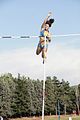 Image 4Anna Giordano Bruno releases the pole after clearing the bar in pole vault (from Track and field)