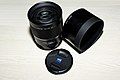 Sony A Zeiss 135mm f1.8 ZA lens with lens cap and SH0003 lens hood