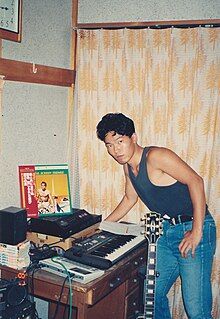 Hideaki Sugai, a Japanese ambient composer, in his home recording studio or‘takuroku' environment during his college years in the mid-80s. The instruments are: KORG Poly-800, YAMAHA TX-81Z, YAMAHA QX21. Roland TR505. Aria Pro II Studio Track III R504. CASIO SK-1, Yamaha SPX90