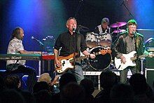 Clarke (right) performing with Kast off Kinks in 2009