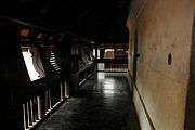 Typical wooden windows and wooden benches (charupadi) of a nalukettu