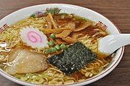 Bowl of ramen with narutomaki garnish