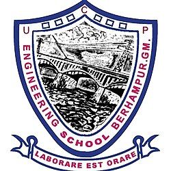 This image is the emblem or logo of *Uma Charan Pattnaik Engineering School (UCPES)*, Berhampur, Ganjam. The emblem includes the Latin phrase "Laborare est orare," meaning "To work is to pray," reflecting the institution's values of hard work and dedication as a form of devotion. The emblem also features an illustration of a bridge, symbolizing engineering and the technical field.