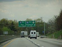 Cars and trucks on four-lane, divided highway