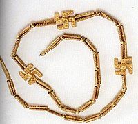 A swastika necklace excavated from Marlik, Gilan province, northern Iran, circa 1,200 – 1,050 BCE