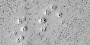 Close view of cones, as seen by HiRISE under HiWish program. These cones probably formed when hot lava flowed over ice-rich ground. The location is the Elysium quadrangle.