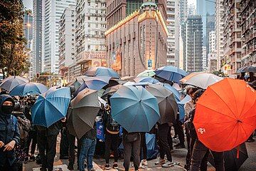 Protesters holding umbrellas