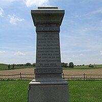 Boggs monument. Inscription reads "Maj. John Boggs born near Wheeling, W. Va 1775 moved to Ohio with his father 1798. Married Sarah McMecher 1800 raised eight children all born in a cabin that stood on this spot. His wife Sarah died 1851. He died 1862."